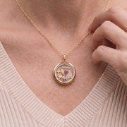 The circle floating locket necklace worn