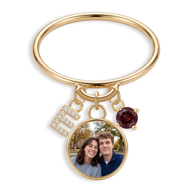 Mini charm ring with an initial, a round photo charm and a birthstone on its loop